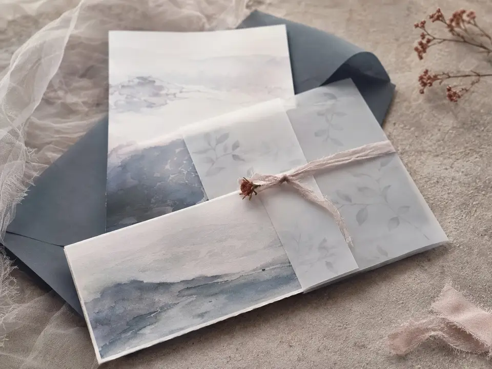 Coastal wedding stationery in muted sea-fog tones