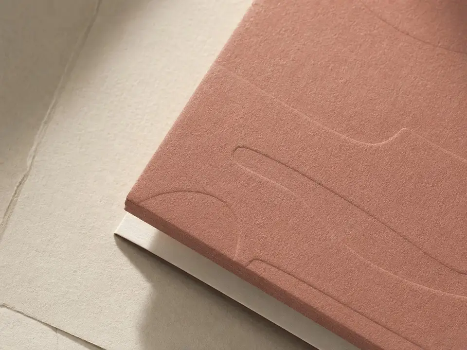 Warm typographic wedding zine in terracotta and cream